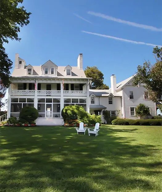 Large white home with large yard